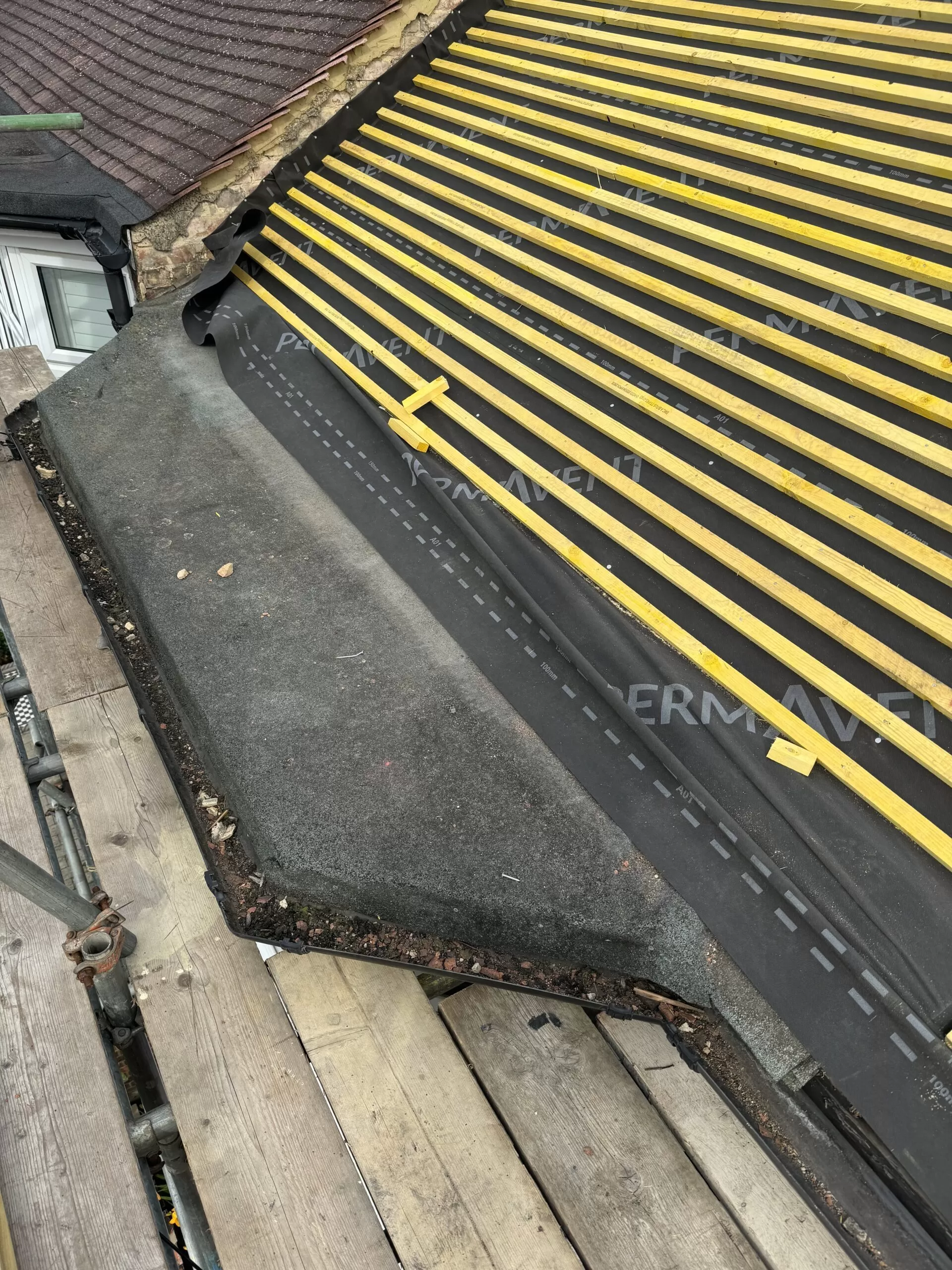 New roof installation with cover.