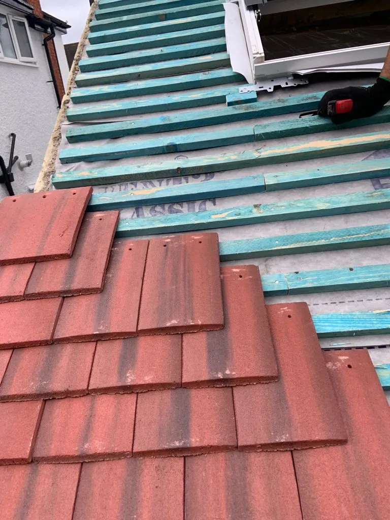 roof repairs with new tiles.