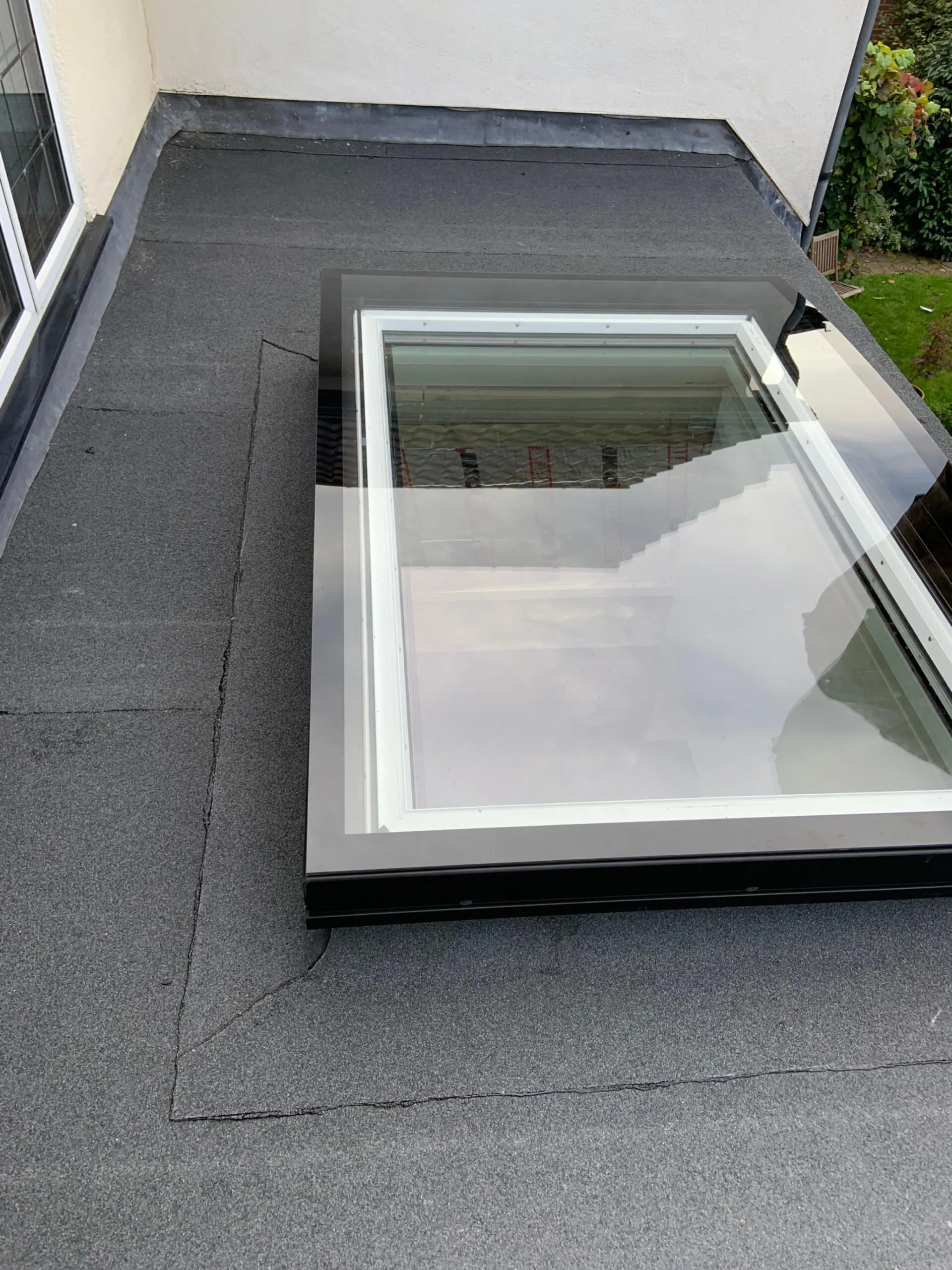 flat roofing with window.