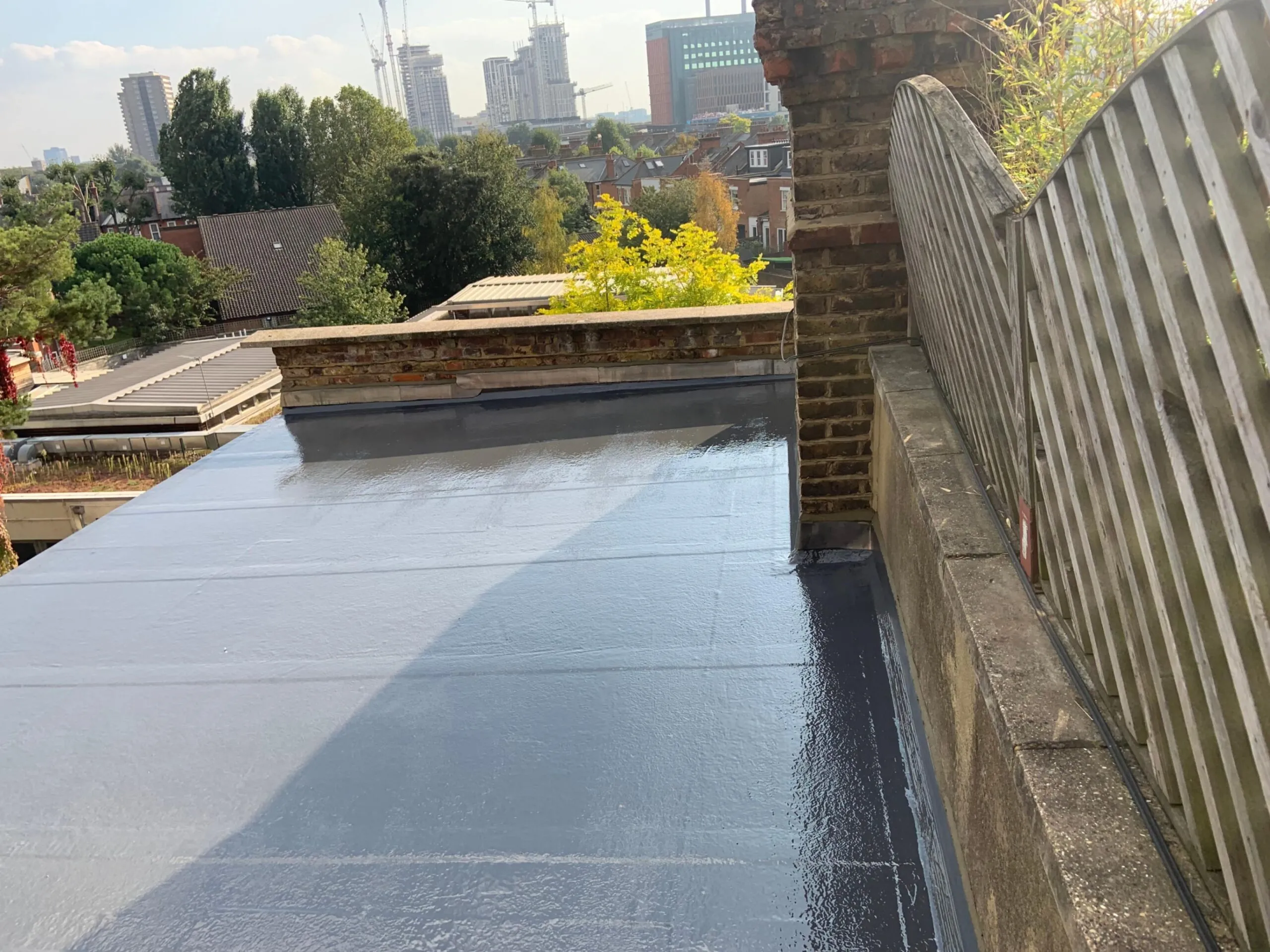 flat roofing with view of London.